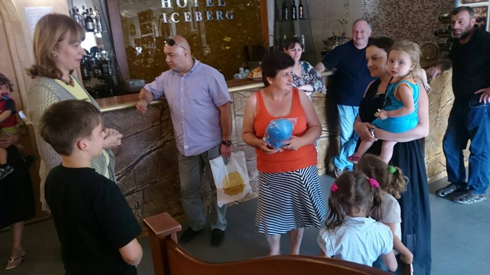 Sandra Roelofs and her son hand out gifts to people affected by the Tbilisi Flood geotv.ge